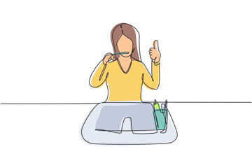 Poster - Continuous one line drawing woman brushing her teeth with thumbs up gesture. Routine habits for cleanliness, health, freshness of mouth and teeth. Single line draw design vector graphic illustration