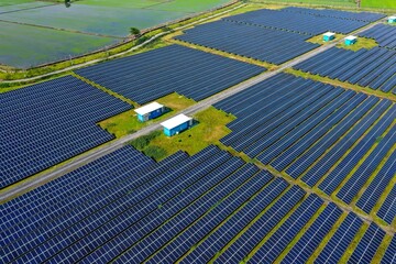 Aerial view of Solar Panels Farm (solar cell). Drone flight fly over solar panels field renewable green alternative energy concept in Thailand. solar energy. power plant.