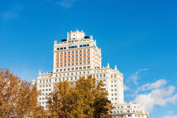 Wall Mural - Madrid downtown. Facade of the skyscraper in Plaza de Espana called Edificio de Espana (Spain Building), 1948-1953 in neo-Baroque style. Community of Madrid, Spain, southern Europe.