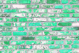 Fototapeta Dinusie - Brick wall with unusual green bricks