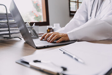 Homecare nursing service and elderly people cardiology healthcare. Close up of young hispanic female doctor nurse check mature caucasian man patient heartbeat using stethoscope during visit