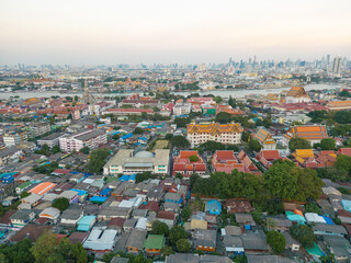 Fototapete - Aerial view Bangkok city buddhist temple with river sunset sky
