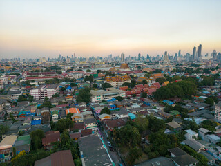 Wall Mural - Aerial view Bangkok city buddhist temple with river sunset sky