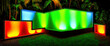 © ADDICTIVE STOCK - AI generative image with large geometric neon illumination in tropical garden