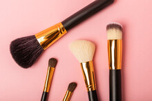 Makeup Brushes On A Pink Background. Stylish Background. Collection Of Cosmetic Makeup Brushes. Beautyconcept. Makeup Tool. Place For Text. Place To Copy.