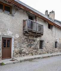 Wall Mural - View of the small village of Les Cours, above Lac du Pontet, near Villar d'Arene and Col du Lautaret, Hautes-Alpes, France