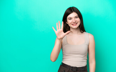 Wall Mural - Young Russian woman isolated on green background counting five with fingers