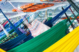 Fototapeta Londyn - Hammocks hanged on the cruise on the Rio Amazons on the way to Belem from Manaus in Brazil
