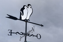 Close-up Of A Weather Vane Depicting Penguins At Ushuaia In Tierra Del Fuego, Argentina