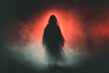 Scary Evil Spirit Haunts The Foggy Woods At Midnight - Dangerous Undead Ghostly Apparition In Form Of Female Silhouette.