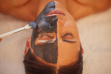 Poster - Spa, woman and charcoal face mask, skincare and luxury for health, wellness and clear skin. Beauty, cosmetics and girl with organic facial, healthcare and detox for cosmetology, acne and massage.