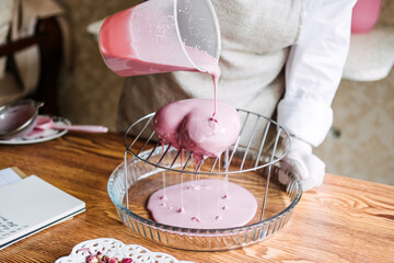 Valentines Day Cupcakes and Cake Recipes Ideas. Valentines Day heart shape pink Mirror Glaze mousse homemade cake on home kitchen