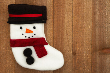 Wall Mural - Snowman stocking holiday border on weathered wood