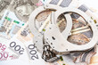 Police handcuffs and Polish banknotes. Crime and punishment concept. Economic crime.