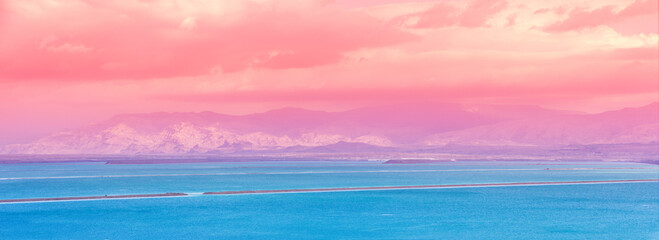 Fototapete - Dead Sea beach. Seascape during sunrise. Salt sea coast in Israel. View of Mount in Jordan. Gradient Color. Horizontal Banner