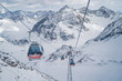 PITZTAL GLACIER, AUSTRIA -  21.12.22:  Gondola cable car and ski slopes in the mountains of Pitztal winter resort, Austrian Alps 