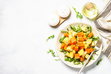 Wall Mural - Warm salad with pumpkin, potato and arugula.