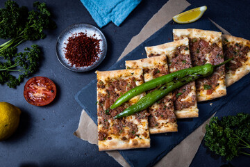 Wall Mural - Turkish pide pastry baked in a stone oven served on stone plate with minced meat