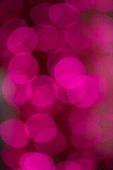 abstract bokeh of pink lights in christmas tree de focus to make blurry circles celebration festive 