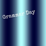 Fototapeta Młodzieżowe - Grammar day text banner against light trail on blue background