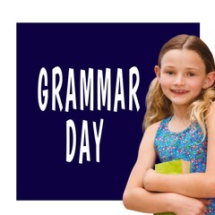 Sticker - Caucasian female student holding a book against grammar day text banner on blue background