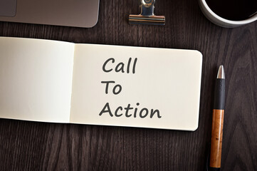 Poster - There is notebook with the word Call To Action. It is an eye-catching image.
