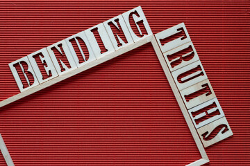 Sticker - bending truths and wood frame on red corrugated paper