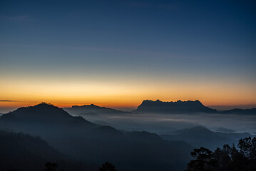 Wall Mural - Majestic view of Doi Luang Chiang Dao in northern Thailand, the third highest mountain in Thailand, seen with beautiful dramatic clouds and colorful sky