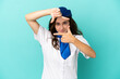 Airplane stewardess woman isolated on blue background focusing face. Framing symbol