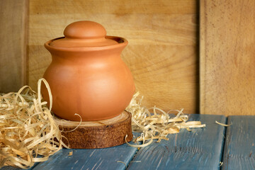 Traditional clay pot for cooking on a wooden table