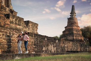 buddha statue in temple si sanphet. Couple woman travel in Historical Park Ayutthaya ,Thailand