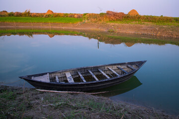 Landscape View of a wooden  boat on the bank of the Padma river in Bangladesh