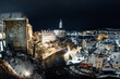Český Krumlov, UNESCO. Historical town with Castle and Church at night. Beautiful winter night landscape with an illuminated monument. Snowy cityscape scene from the Cesky Krumlov, Czech Republic
