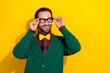 © deagreez - Photo portrait of young attractive male touch try on new specs check vision wear trendy green outfit isolated on yellow color background