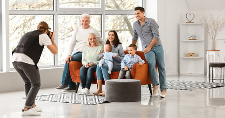 Canvas Print - Photographer and happy family in studio