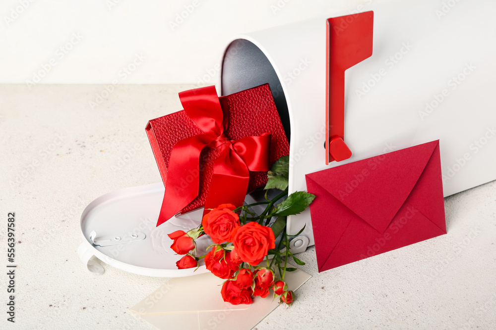Mailbox with letters, gift and roses on white background. Valentine's Day celebration