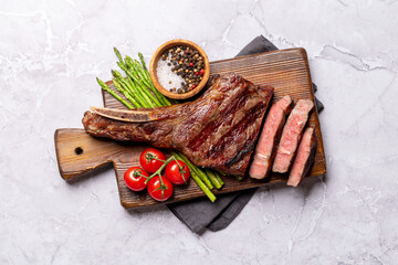 Sticker - Medium rare grilled Tomahawk beef steak with asparagus