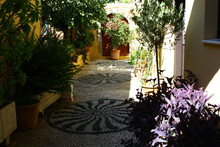 Picturesque Alley In The Old Part Of Rhodes Town With Cobblestone Path With Mosaic, Greece