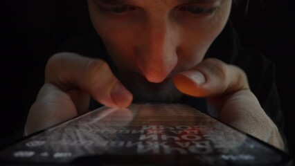 The Whole Life is in the Smartphone. A Man Quickly flips through videos from Social Networks with two Fingers.