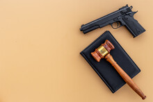Gun Law Concept. Hand Gun Weapon And Judges Gavel. Crime Background