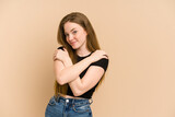 Fototapeta Panele - Young redhead woman cut out isolated hugs, smiling carefree and happy.