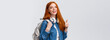Waist-up portrait joyful cute redhead girl inviting freshmen apply univeristy, got scholarship, smiling showing thumbs-up in approval, recommendation, holding backpack and headphones