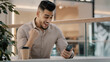 © Yuliia - Indian Hispanic man happy shocked amazed male businessman has offer online message good news excited winner guy win victory financial prize with smartphone lucky celebrating winning with mobile phone