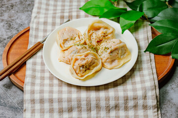 Wall Mural - kimchimandu, Korean Kimchi dumpling : Kimchi dumplings are stuffed with a filling of chopped kimchi, bean curd, and vegetables. They are the most popular type of dumpling among Koreans.