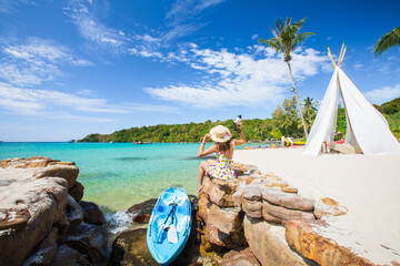 Young Asian lady tourist on the beach  at the tropical sea. Trat Province, Thaiand.