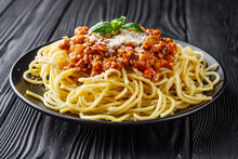 Delicious Bolognese Pasta On A Black Plate