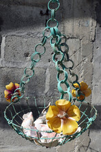 Recycled Turquoise Painted Wire Basket With Yellow Plastic Bottle Flowers And Natural Seashells