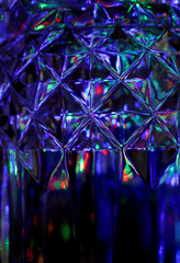 Wall Mural - abstract background with colored light reflections on crystal glass.Shiny colorful Christmas background