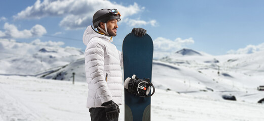 Sticker - Profile shot of a man standing with a snowboard