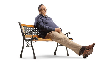 Poster - Pensive mature man sitting on a bench